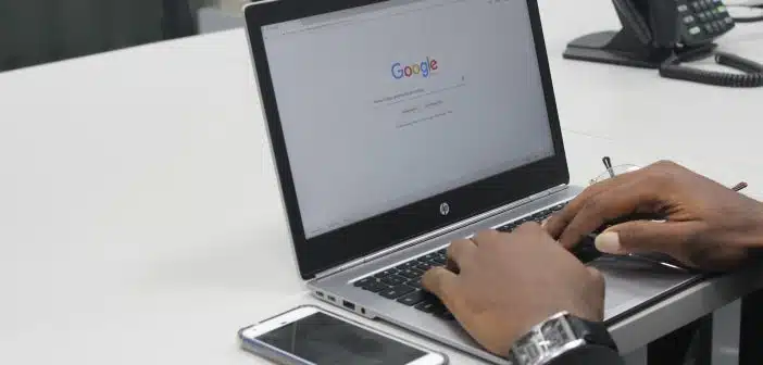 person typing on gray and black HP laptop